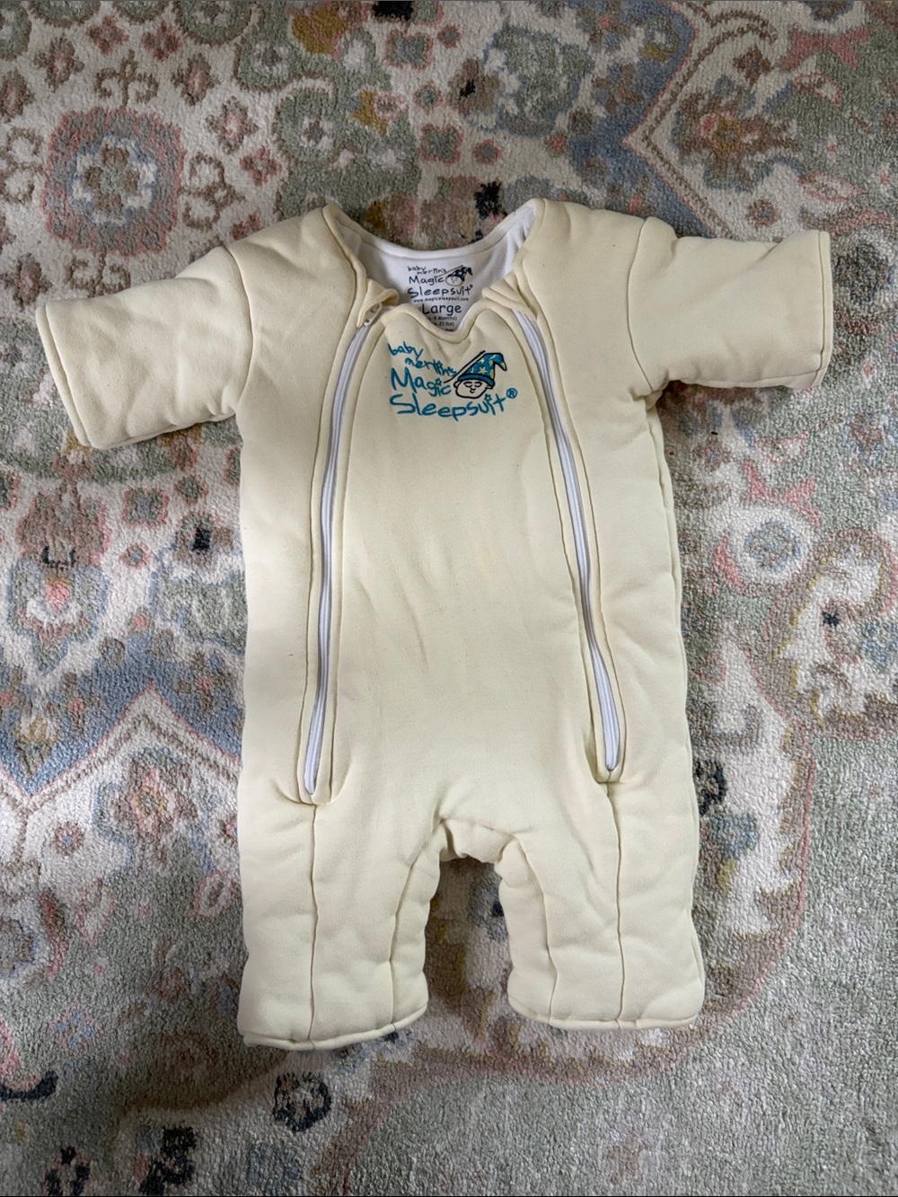 Baby Merlinโs Magic Sleepsuit (Size 6-9 months or Large) in Cream